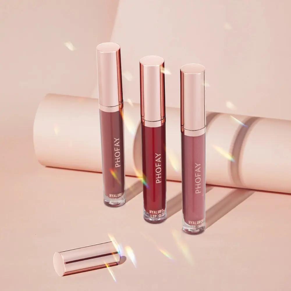 Four PHOFAY Hyaluronic Lip Gloss tubes in varying shades of pink and nude with soft-glossy finish and light pink caps on a.