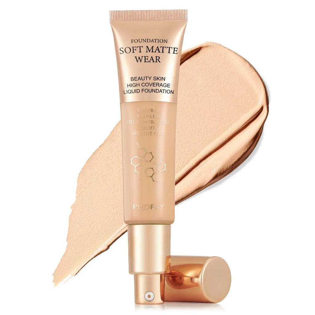 Soft Matte Wear foundation tube with light beige liquid foundation swatch behind, gold cap, elegant packaging.