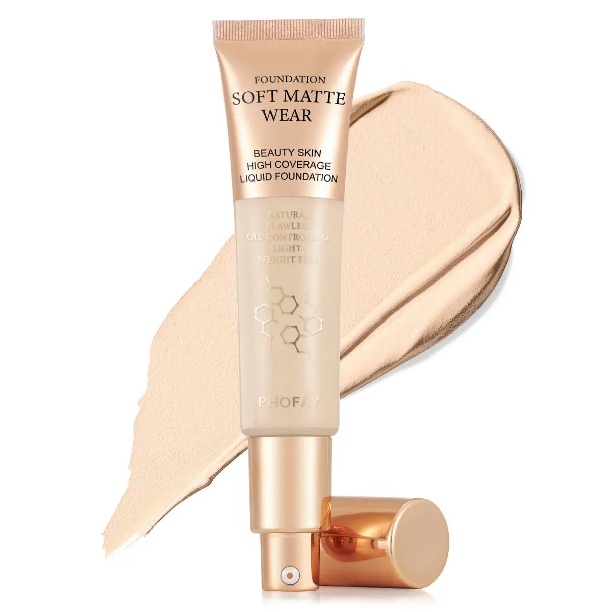 Light beige tube of foundation with gold cap on beige matte liquid swatch background.