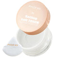 Transparent loose setting powder in clear jar with peach lid and white puff applicator.