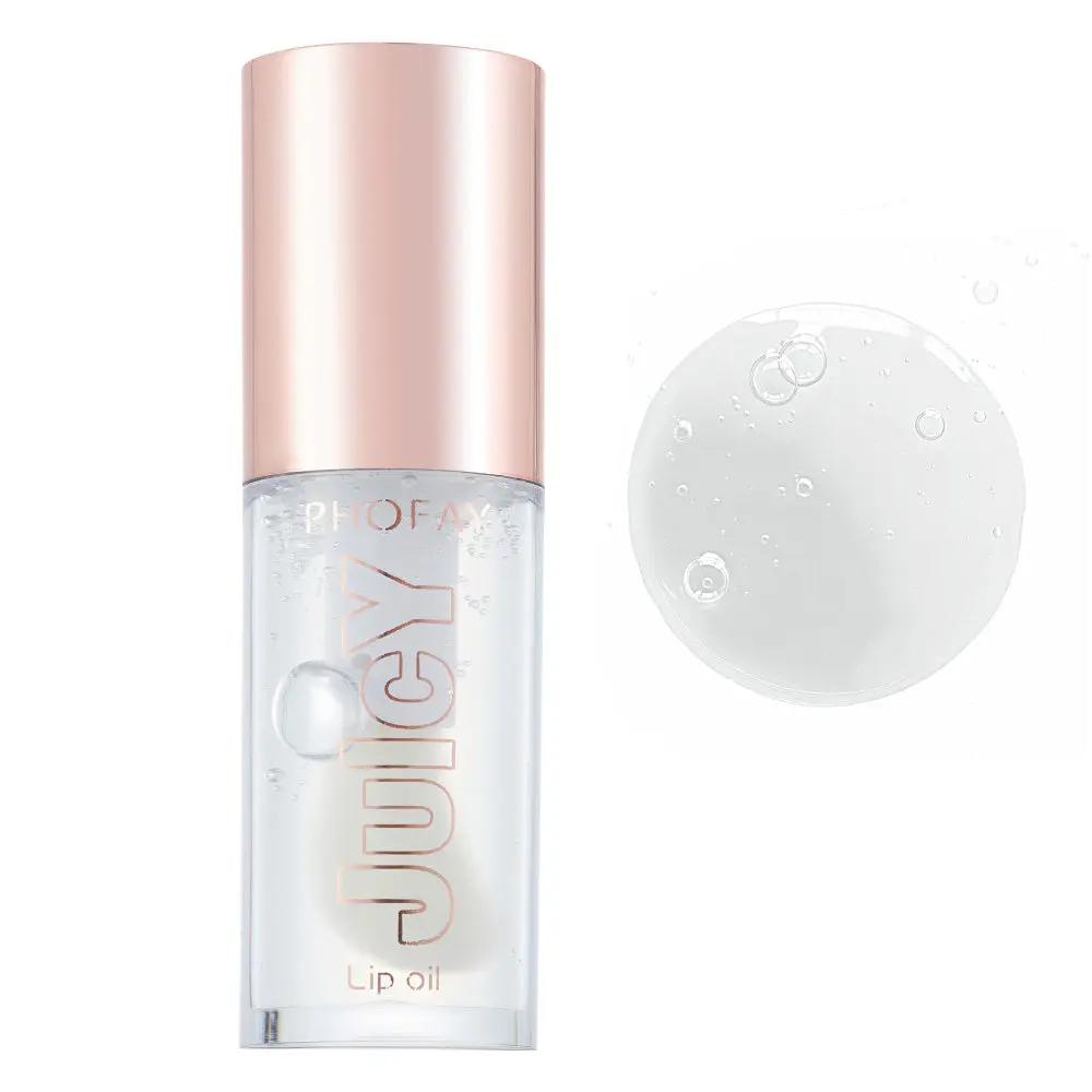 Clear lip oil in a small transparent bottle with a shiny rose gold cap and "JUICY" text on the front.