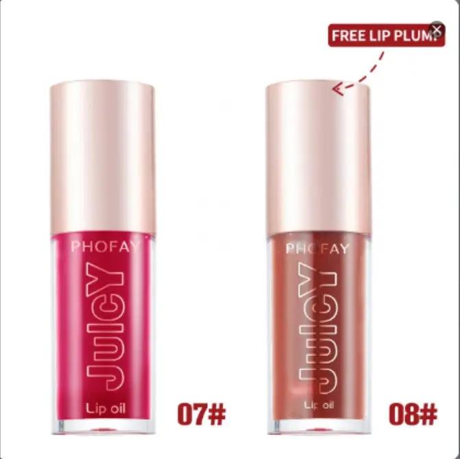 Two PHOFAY Juicy Lip Oils in shades 07 bright pink and 08 muted nude, with frosted glass tubes and rose gold caps.